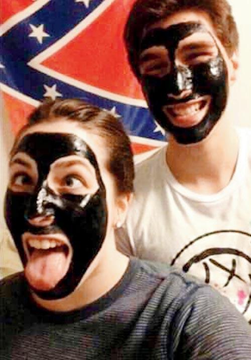 Students of Southern Illinois University pose in ‘blackface’ — a racial epithet — in front of a Confederate Flag to celebrate Trump
