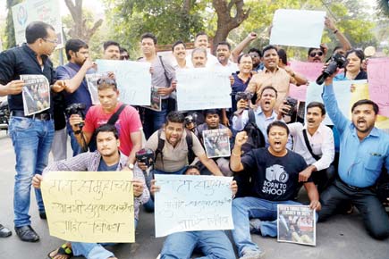 mid-day lensman assault: Brute guards arrested but not sacked