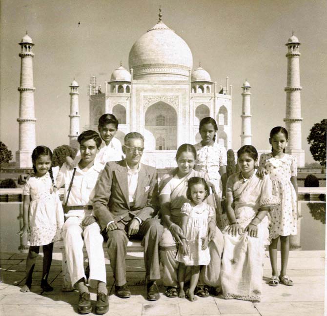 Tukaram Chaudhari with his wife and six children seen at the Taj Mahal, Agra, during a family holiday in 1954