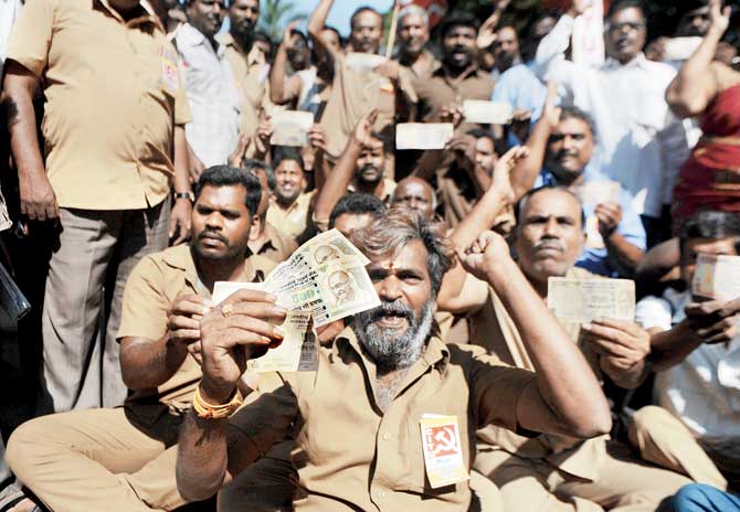 Two weeks after PM Narendra Modi announced the note ban, trade union workers protest against the move in Chennai. Pic/AFP