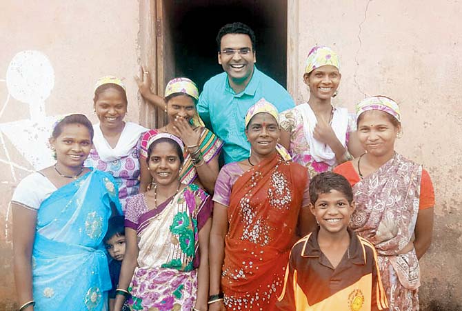 Varun Inamdar with the tribal cooks at Aarey Colony
