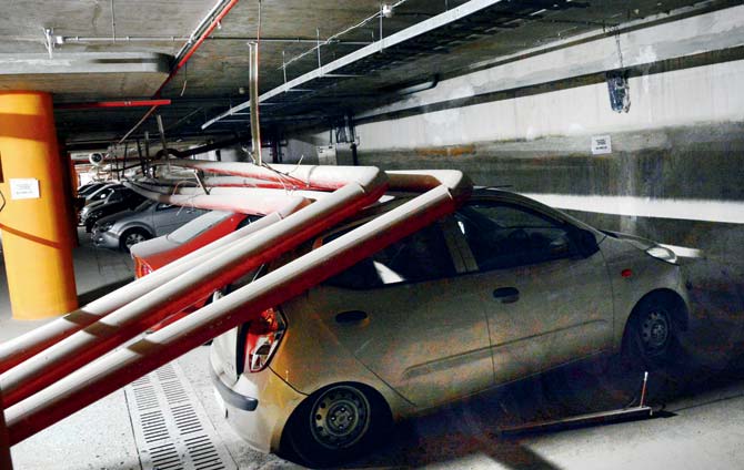 Cars crushed under the pipes