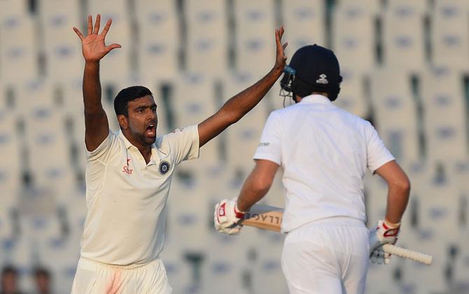 R Ashwin (L) succesafully appeals for an LBW decision against England batsman Ben Stokes on the third day of the third Test match between India and England at The Punjab Cricket Association Stadium in Mohali on Monday. Pic/AFP