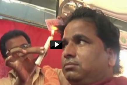 'Hot' Video: Barber uses candles for haircuts