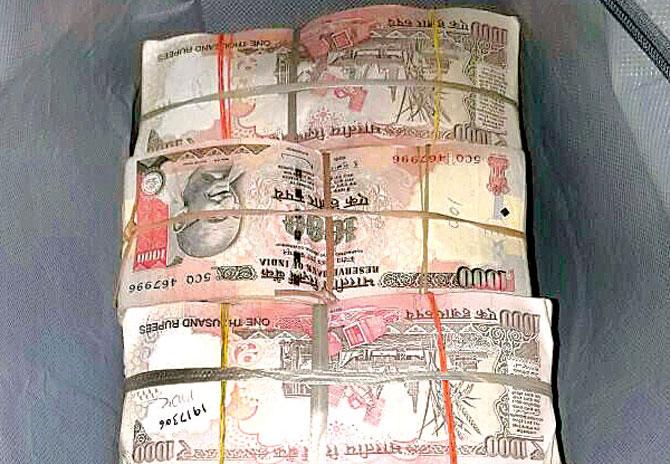 The cash that was found in the car intercepted by the Navi Mumbai crime branch