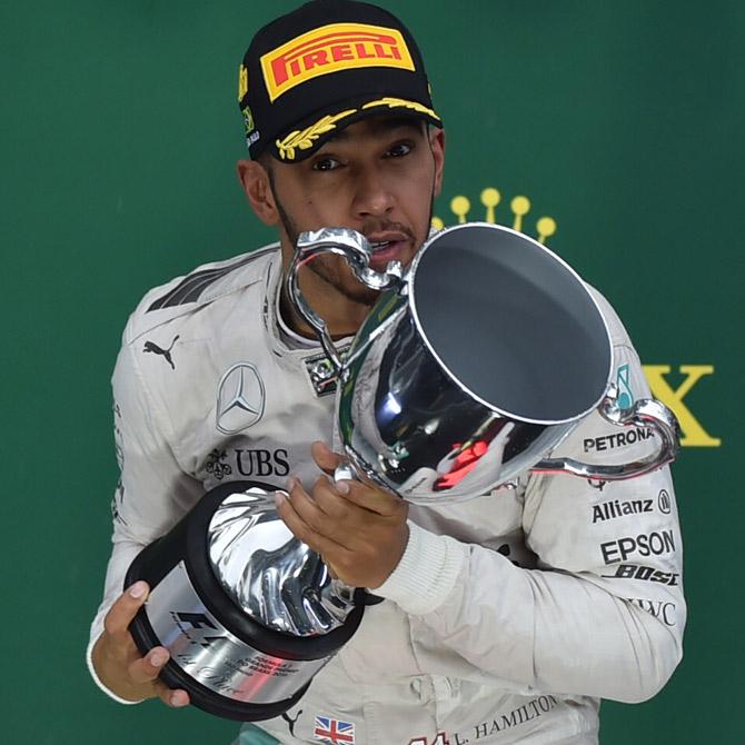 Lewis Hamilton with his trophy