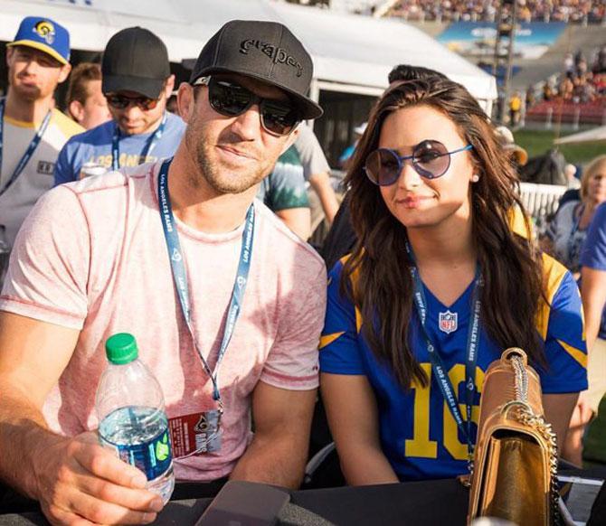 UFC fighter Luke Rockhold and American singer Demi Lovato at a NFL game in Los Angeles recently 