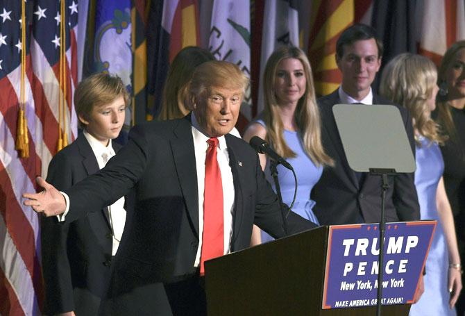 Donald Trump with his family during election night at the New York Hilton Midtown in New York on November 9, 2016. Trump won the US presidency. / AFP PHOTO