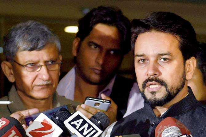 BCCI prez Anurag Thakur interacts with media as secretary Ajay Shirke (left) looks on at BCCI’s headquarters in Mumbai on Saturday. PIC/PTI