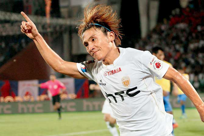 North East United FC’s Katsumi Yusa celebrates after scoring the opening goal against Kerala Blasters in Guwahati yesterday