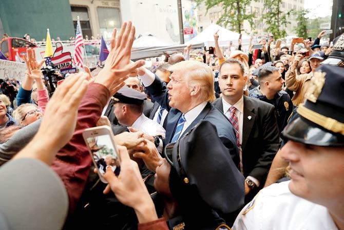 Trump, who has spent his last 24 hours in his Trump Tower, made a brief appearance before his supporters at the lobby. On Sunday, he will face a confident Clinton for the second presidential debate. Pic/PTI