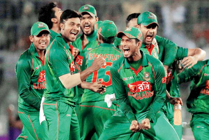 Bangladesh celebrate Jos Buttler’s wicket on Sunday. Pic/AP,PTI