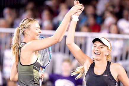 Smiles and high fives as Maria Sharapova returns to action