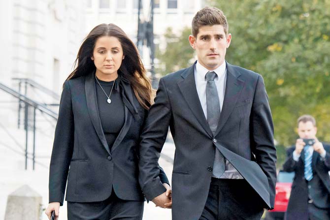 Ched Evans leaves Cardiff Crown Court with partner Natasha Massey after being found not guilty of rape yesterday. PIC/Getty Images