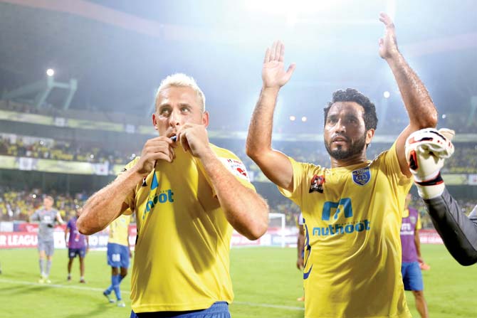 Kerala Blasters’ Michael Chopra (left) celebrates a goal with a teammate during ISL-3 tie against Mumbai City at Jawaharlal Nehru Stadium in Kochi yesterday. pic/sportzpics