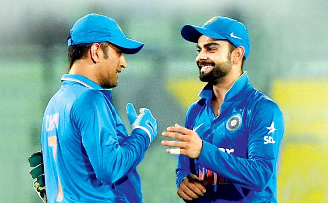 India limited overs skipper MS Dhoni (left) with Virat Kohli at Mirpur last year. Pic/AFP