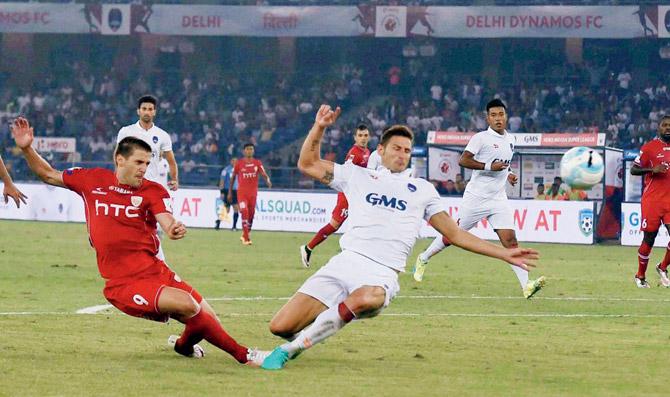 Acion from the ISL-3 match between NorthEast United FC and Delhi Dynamos in New Delhi on Saturday. Pic/PTI