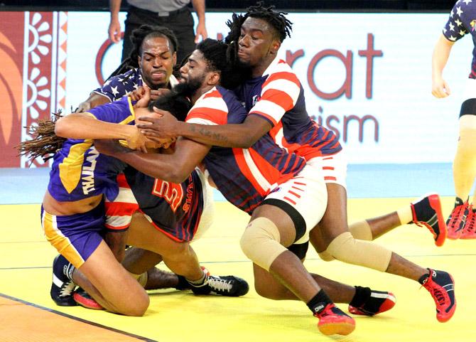 Player of USA kabbadi team catch rider player from Thailand during the Kabaddi World Cup 2016 match in Ahmedabad. Pic/PTI