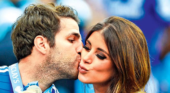 Fabregas kisses his partner Daniella Semaan after a Premier League match in London last year. Pics/Getty Images