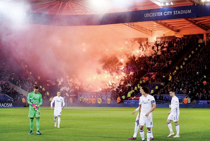 FC Copenhagen fans light flares in the King Power Stadium during the Champions League match against Leicester City in Leicester on Tuesday. Pic/AFP