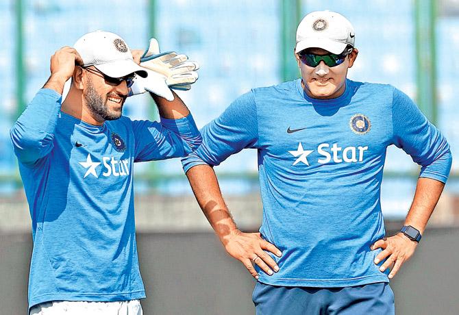 MSâÂu00c2u0080Âu00c2u0088Dhoni (left) interacts with head coach Anil Kumble during a training session at the Kotla in New Delhi yesterday. Pic/AFP