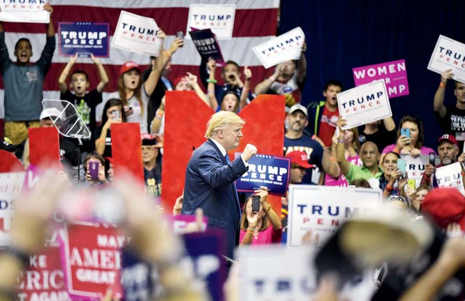 Republican presidential nominee Donald Trump makes his way off stage after a rally at the Cambria County War Memorial Arena in Johnstown, Pennsylvania, on Friday. Pic/AFP