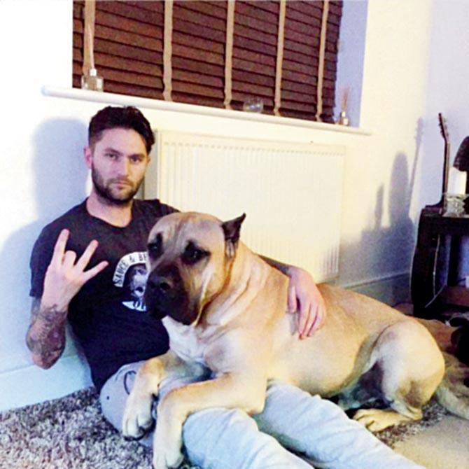 Henri Lensbury posted this picture on Twitter with one of his dogs 