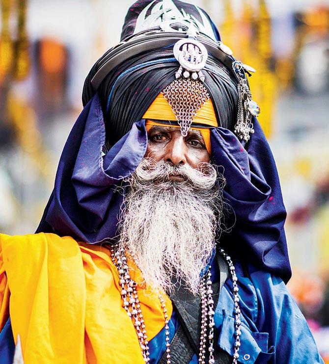 A Nihang Sikh in  his vibrant attire 