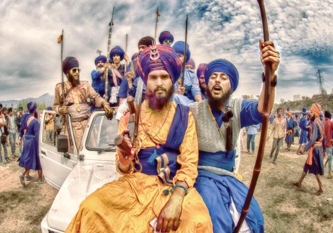 Nihang Sikhs carrying swords, daggers and spears