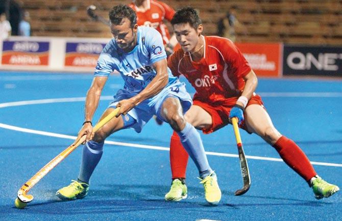 India and South Korea players vie for the ball during the Asian Champions Trophy match at Kuantan, Malaysia on Saturday