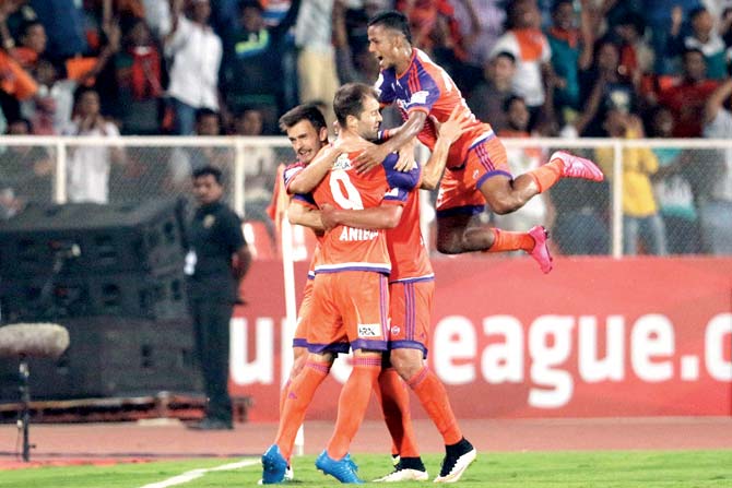 FC Pune City players celebrate a late equaliser against Chennaiyin FC during the ISL-3 tie in  Pune yesterday. Pic/Sportzpicz