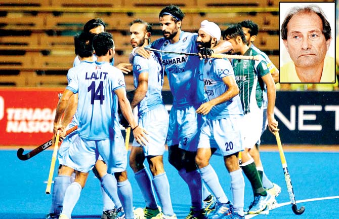 Indian players celebrate a goal against Pakistan during the Asian Champions Trophy tie in Kuantan, Malaysia on Sunday. Inset: Roelant Oltmans