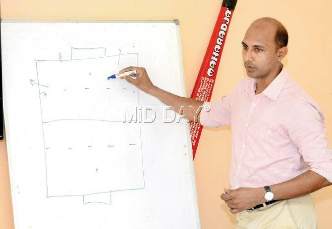 The Maharashtra team listen to umpire Javed Shaikh