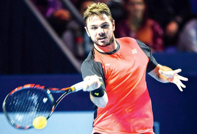 Swiss Stan Wawrinka returns against compatriot Marco Chiudinelli during the Swiss Indoors tournament in Basel on Tuesday. Pic/AFP