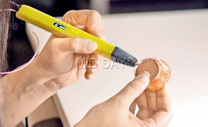 The pen works on many surfaces, including clay and wood