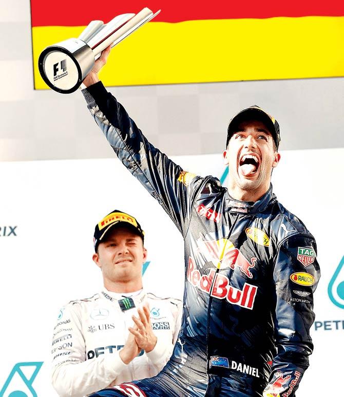 Daniel Ricciardo celebrates on the podium. Pics/Getty Images,AP