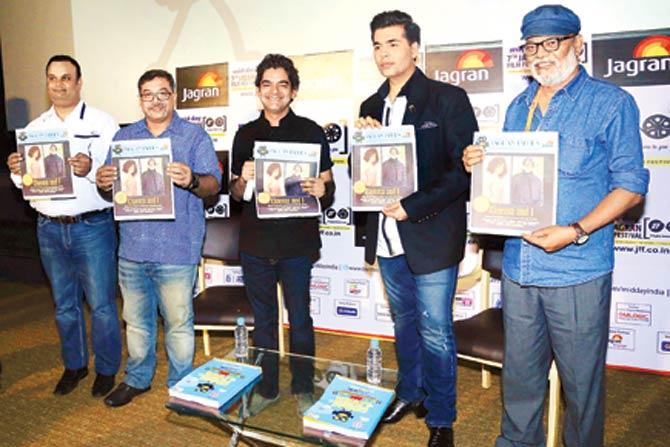 Karan unveils a tabloid, Cinema And I at the 7th Jagran Film Festival on Saturday. On the dais with him are (from left) Vinod Shrivastava, Prashant Kashyap, Mayank Shekhar and Ajay Brahmatmaj 