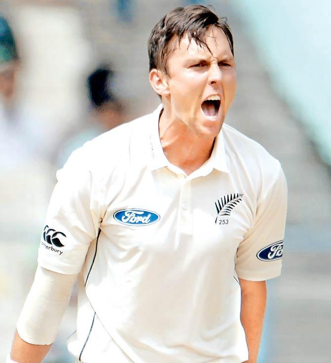 Boult celebrates the wicket of Shikhar Dhawan on Day Three of the second Test at Eden Gardens in Kolkata yesterday. Pic/AFP
