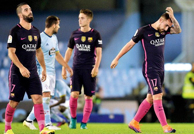 Barca players pose a dejected look after their loss to Celta Vigo in the La Liga tie at Balaidos Stadium in Vigo on Sunday. Pic/Getty Images
