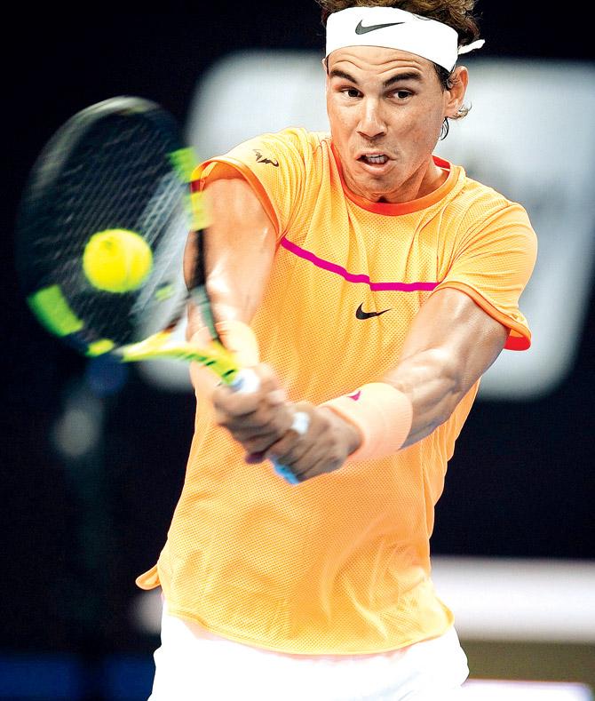 Nadal returns to Paolo Lorenzi in Beijing yesterday. Pic/AFP