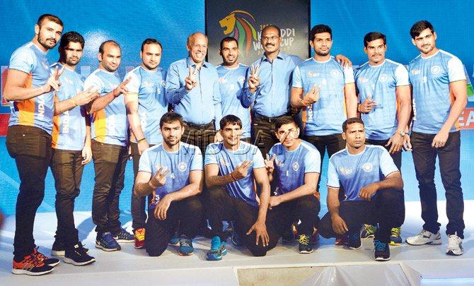 Indian skipper Anup Kumar (encircled) along with coaches and teammates pose for pictures after the announcement of the team squad for the Kabaddi World Cup in Mumbai recently. Pic/Satej Shinde