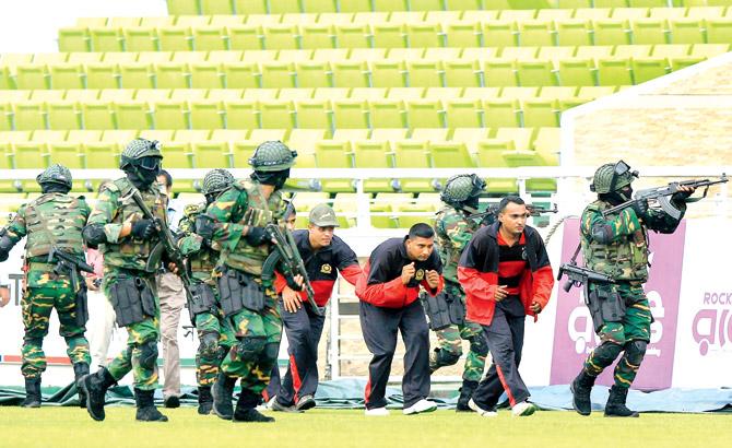 Bangladesh commandos participate in a mock war game at the Sher-e-Bangla National Stadium yesterday. Pic/AFP