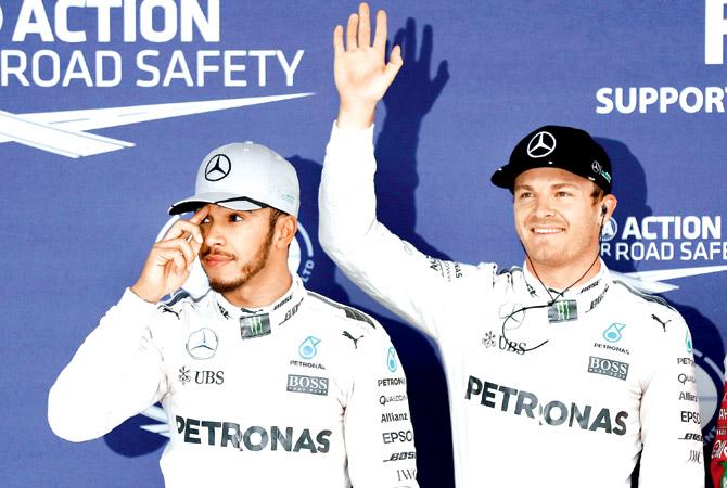 Nico Rosberg (right) and Lewis Hamilton of Mercedes after the Japan GP qualifying on Saturday. Pic/Getty Images 