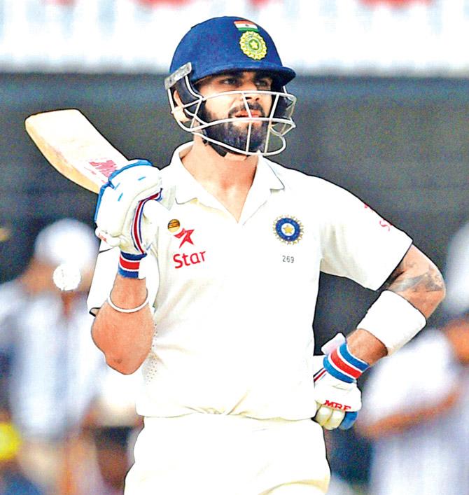 Virat Kohli during to his 103 not out on Day 1 of the third Test against NZ in Indore on Saturday. Pic/PTI