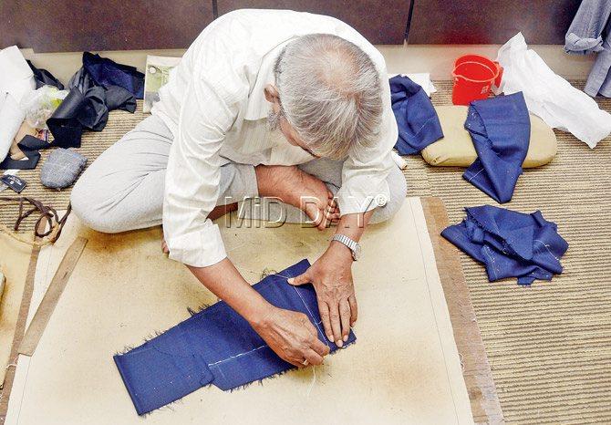 A tailor at work in the store 