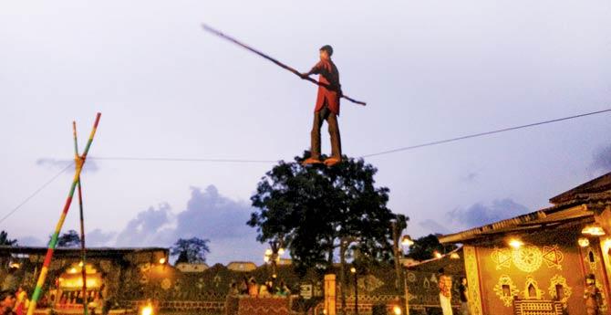 Acrobatics perform against the setting sun at Chokhi Dhani