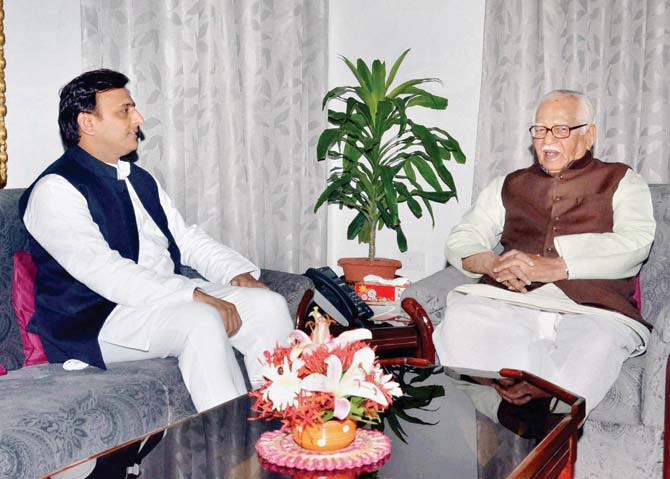 Akhilesh Yadav with Governor Ram Naik. Pic/PTI