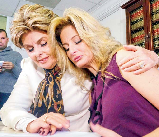 Attorney Gloria Allred (L) comforts Summer Zervos during a news conference in Los Angeles. Pic/AP