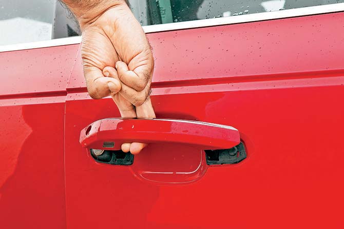 Deceptive door handle needs to be lifted and not tugged