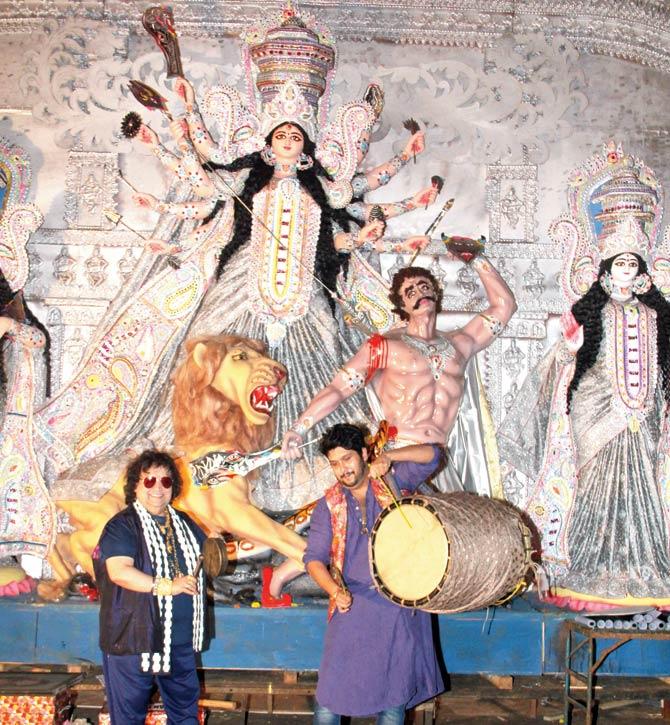 Bappi Lahiri with son Bappa at the North Bombay Sarbojanin Durga Puja